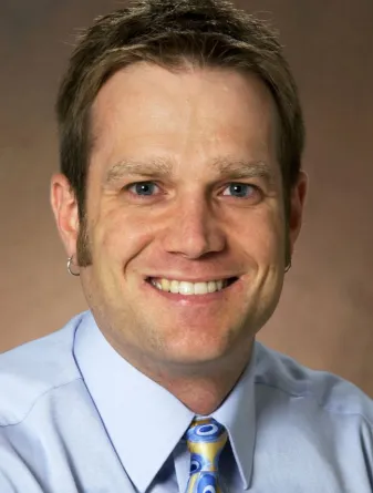 Shane Stafslien smiling confidently into the camera.