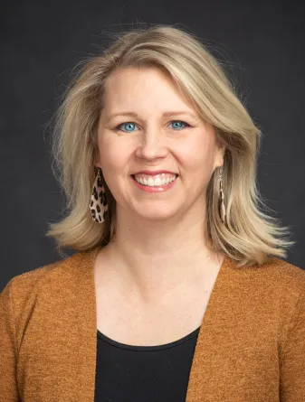 Rachel Larson smiling confidently into the camera.