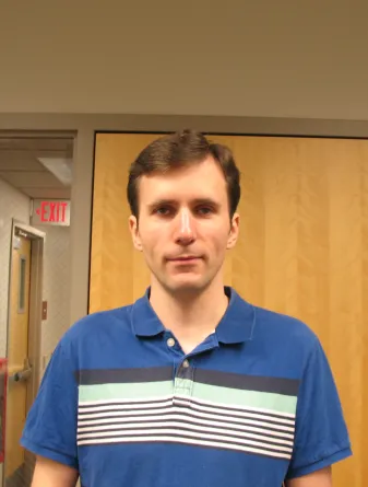 Ivan Hevus smiling confidently into the camera.