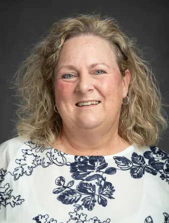 Connie Koski smiling confidently at camera