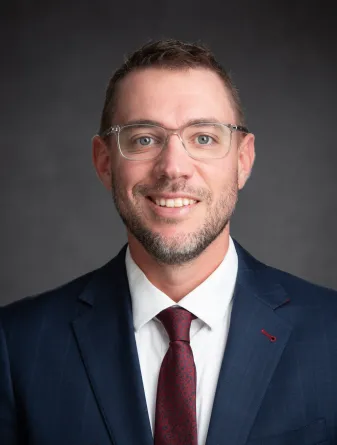 Meyer smiling confidently at camera.