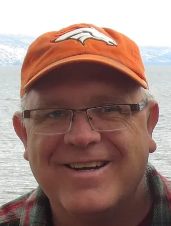 Craig smiling confidently at camera.