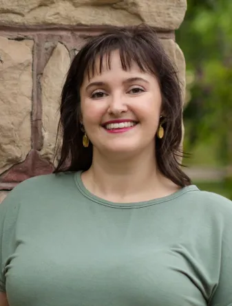 Chatham-Vazquez smiling confidently at camera.