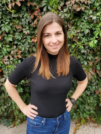 Beck smiling confidently at camera.