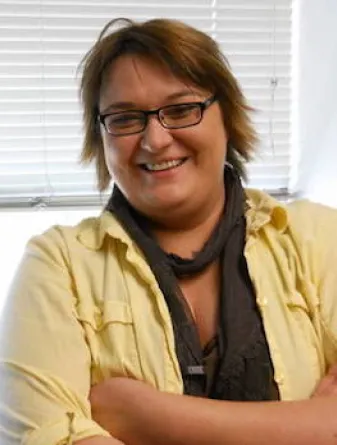 Verena Theile smiling confidently at camera.