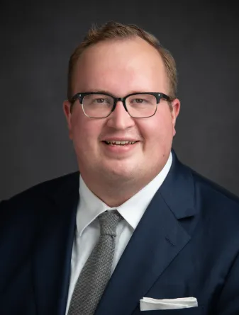 Bruce Kovanen smiling confidently at camera.