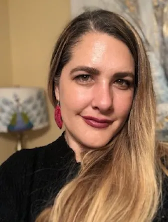 Natalie Smith Carlson smiling confidently at camera.