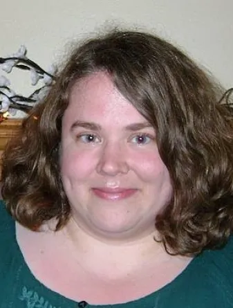 Cameron smiling confidently at camera.