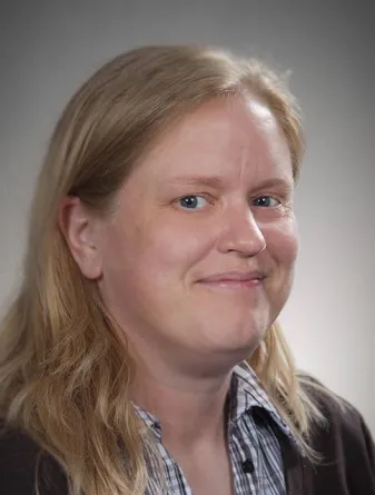 Jamee Larson smiling confidently at camera.