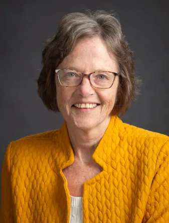 Kelly smiling at the camera