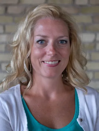 Heather Fischer smiling confidently at camera