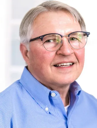 Craig Larson smiling confidently at camera.
