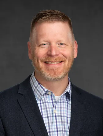 Dr. Briggs smiling confidently at camera.