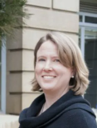 Dr. Carlson smiling confidently at camera.