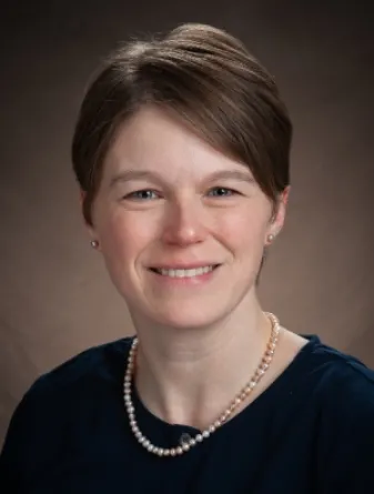 Dr. Nelson smiling confidently at camera.