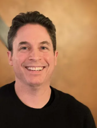 Dr. Pemstein smiling confidently at camera.