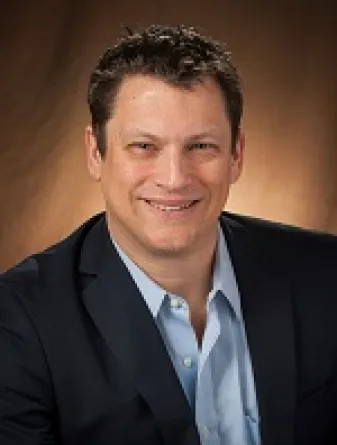 Hilmert smiling confidently at camera