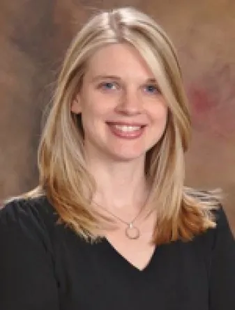 Dr. Leah Irish confidently staring at the camera