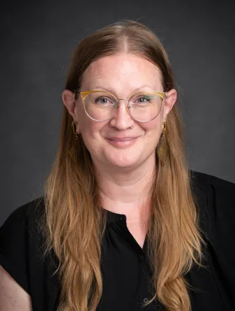 Kim smiling at the camera.