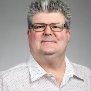 Chris Colbert looking confidently at camera.