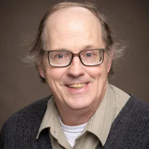 John Hershberger smiling confidently at the camera