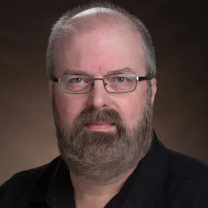 Seth Rasmussen smiling confidently at the camera