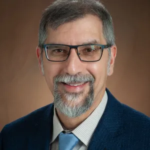 Bernhardt Saini-Eidukat smiling confidently at the camera