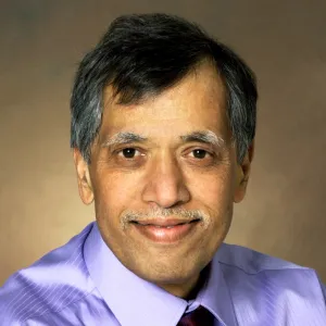 Mukund Sibi smiling confidently at the camera