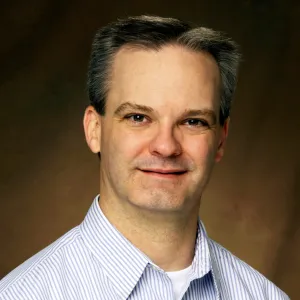 John Wilkinson smiling confidently at the camera