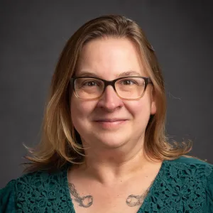 Emily Vieweg smiling confidently at the camera