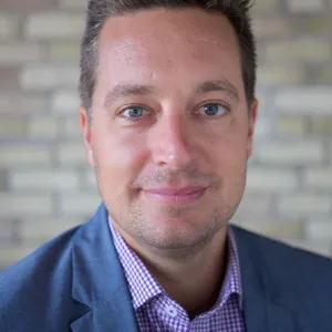 Fischer smiling confidently at camera