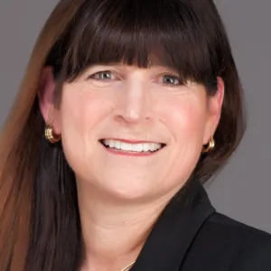 Susan Schaefer Kliman smiling confidently at camera