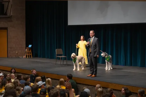NDSU President David Cool, wife, Kate Cook and pet dogs.