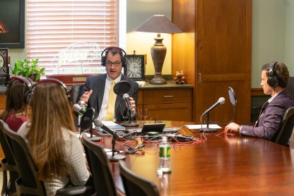 Photo of President David Cook and NDSU students on sales podcast