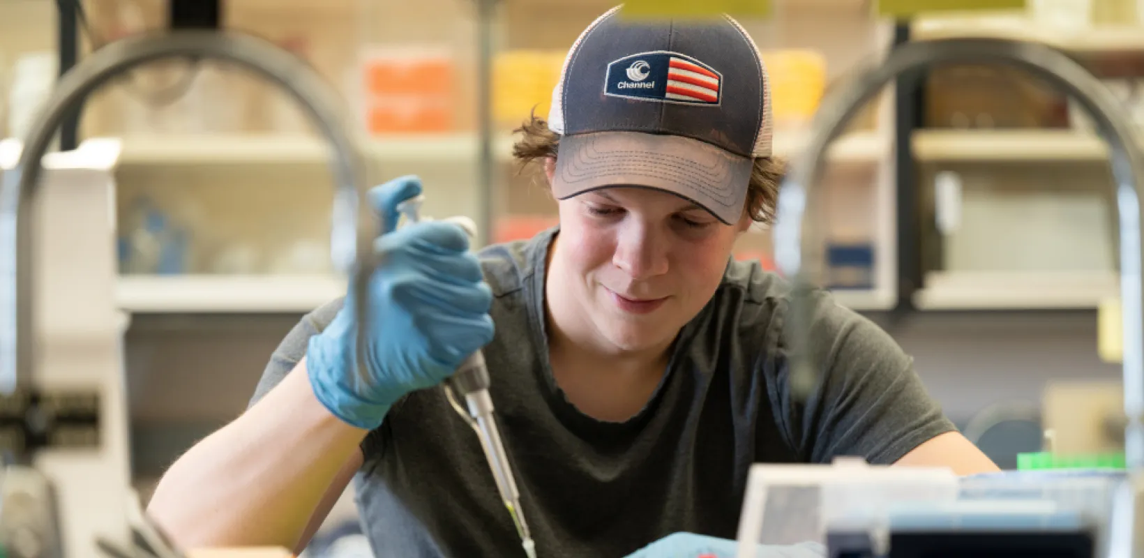 NDSU student working with samples in a lab