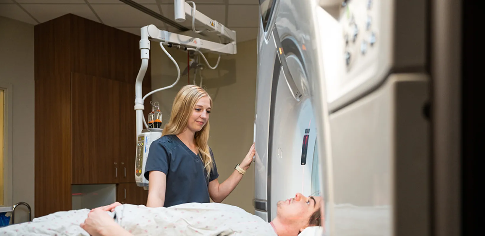 nurse performing a scan on a patient