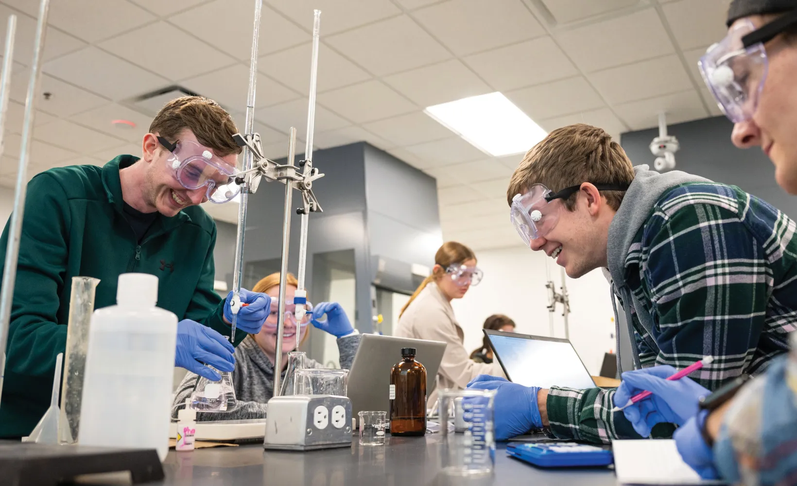 Students performing an experiment in lab