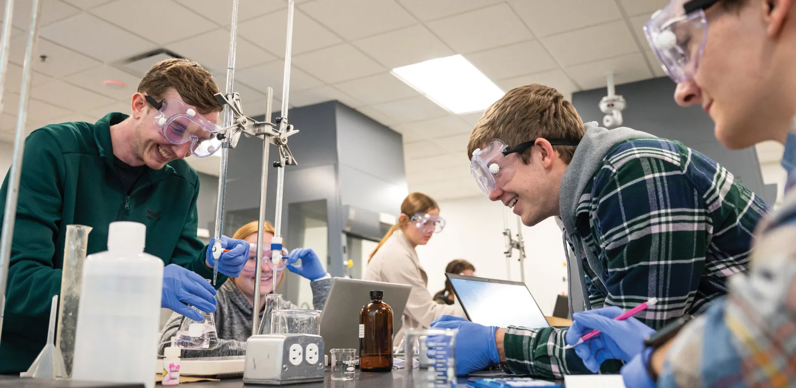 Students performing an experiment in lab