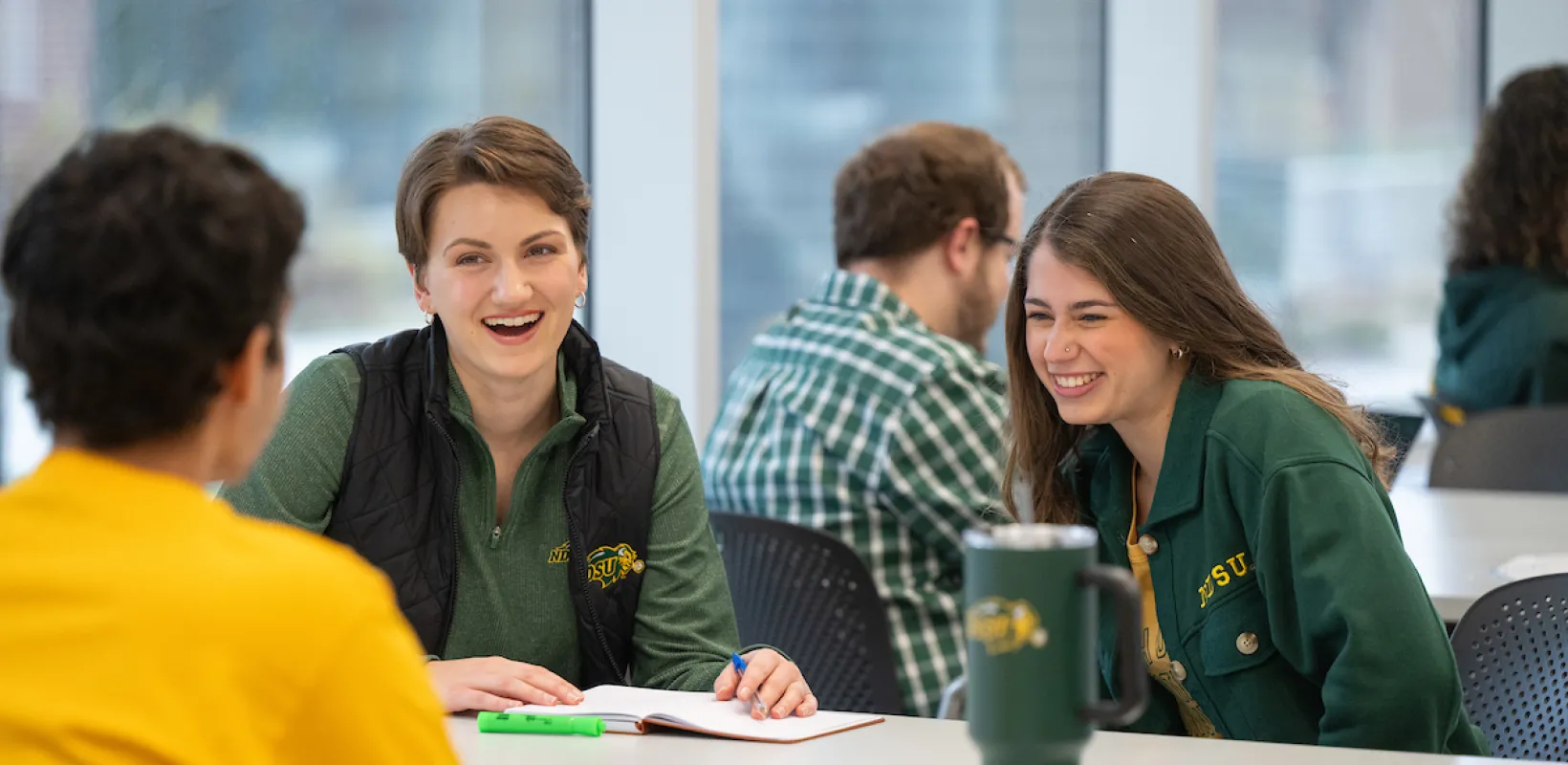 NDSU Students talking and studying at table