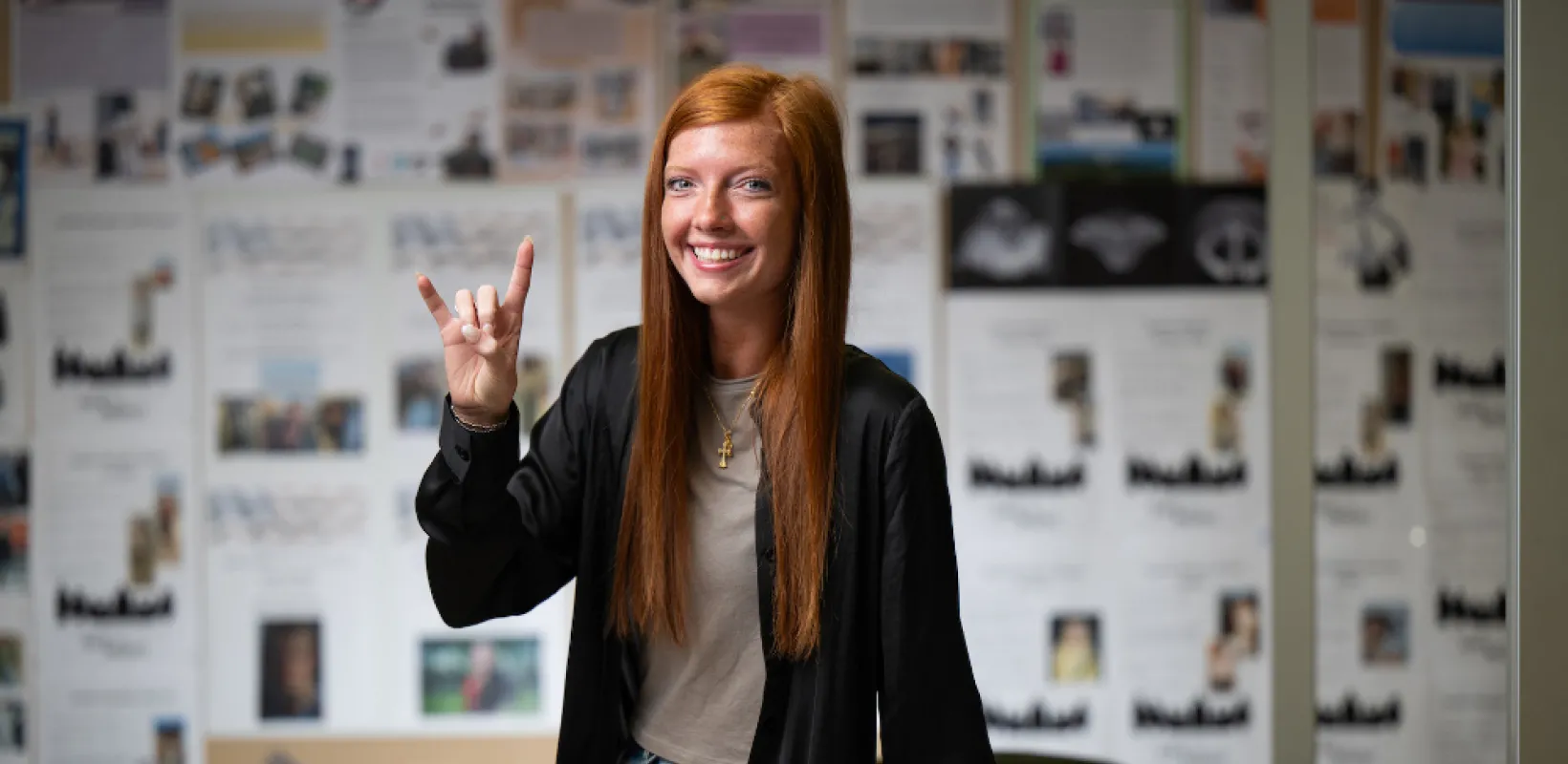 Hanna Kuhn smiling with Bison horns