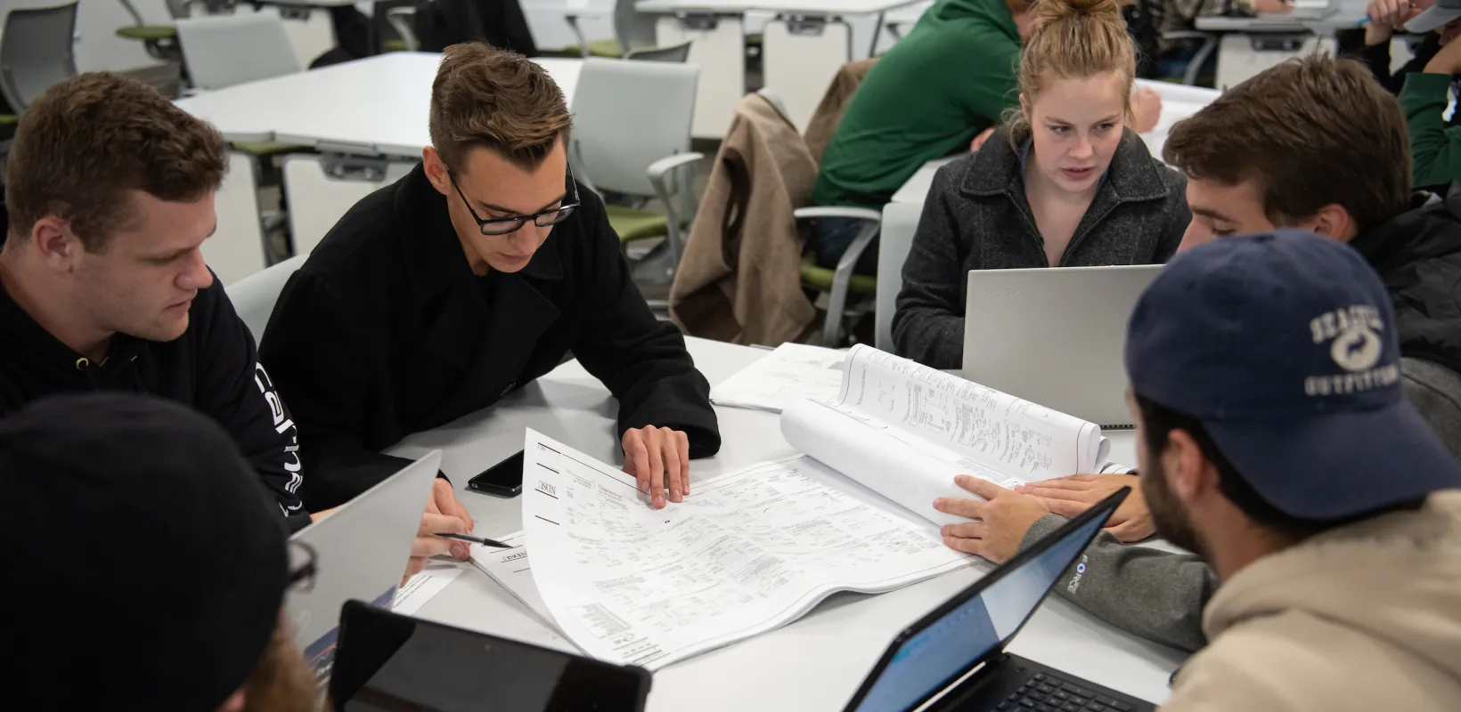 students studying construction plans