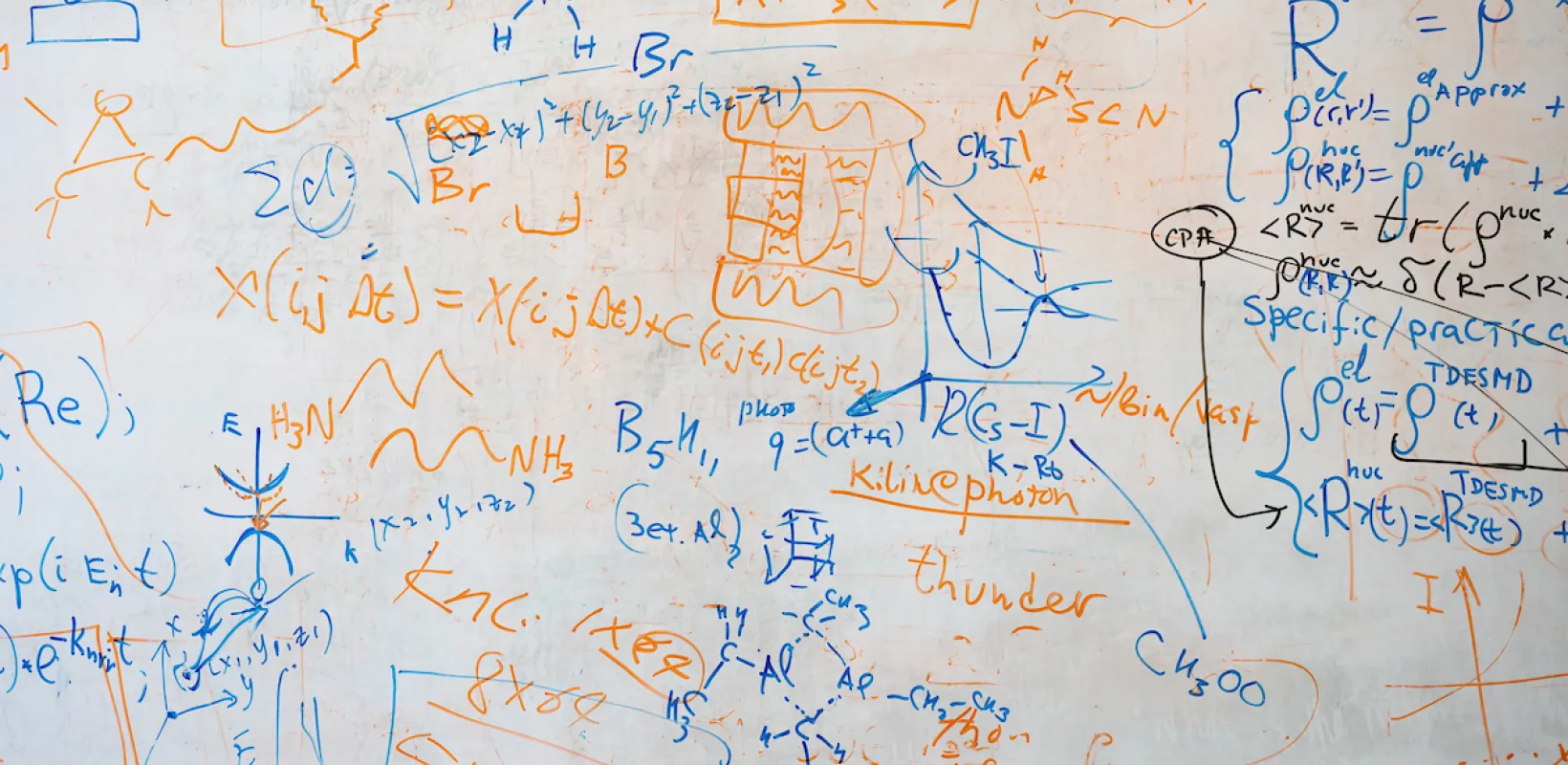 white board with mathematics equations on it