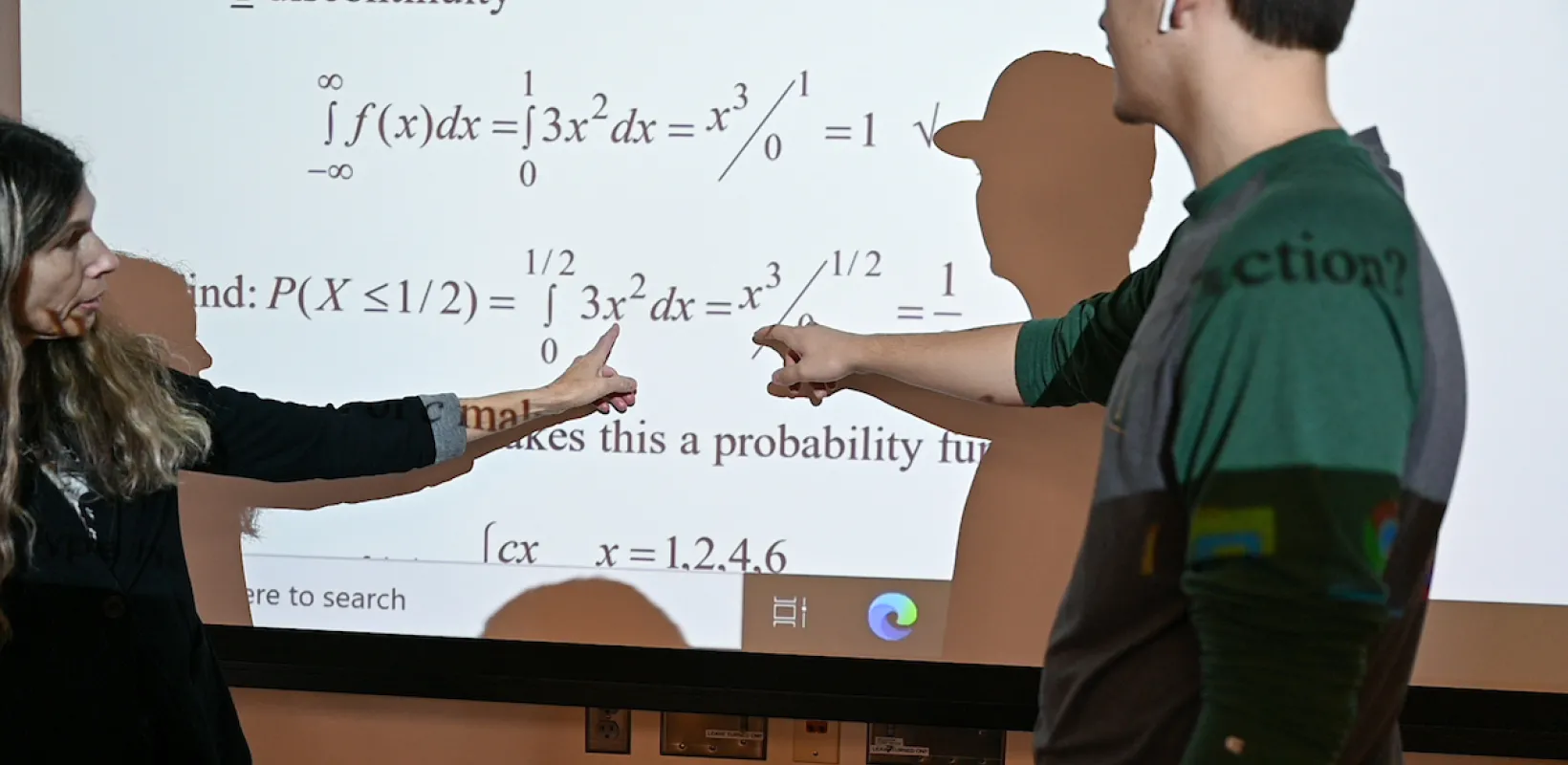 professor explaining an equation to a student