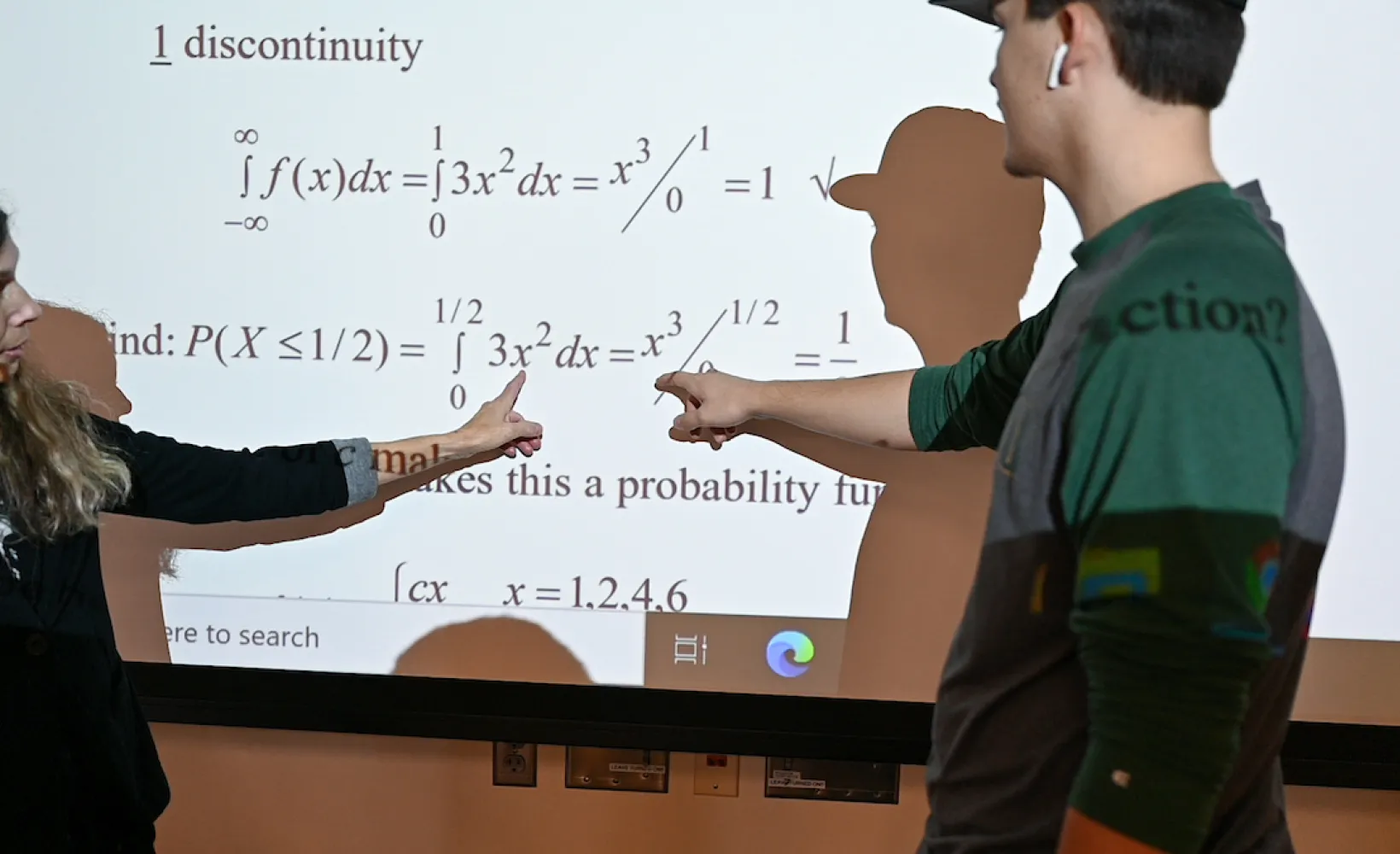 NDSU Mathematics professor explaining an equation to a student