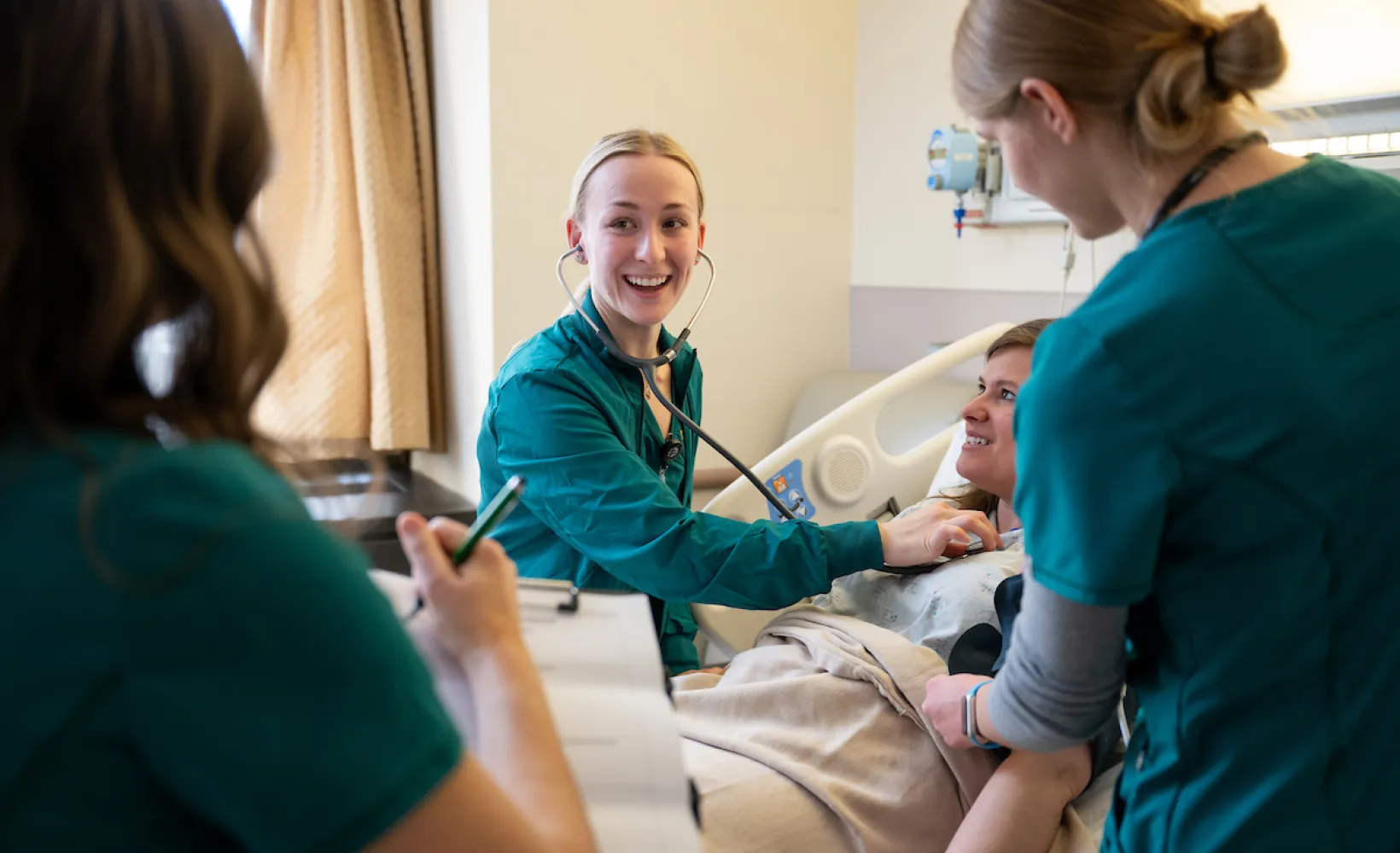 nursing students practicing patient care
