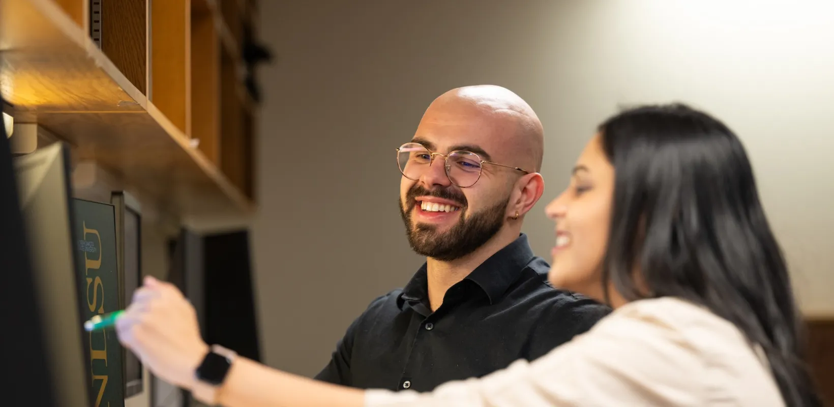 students researching information in the library