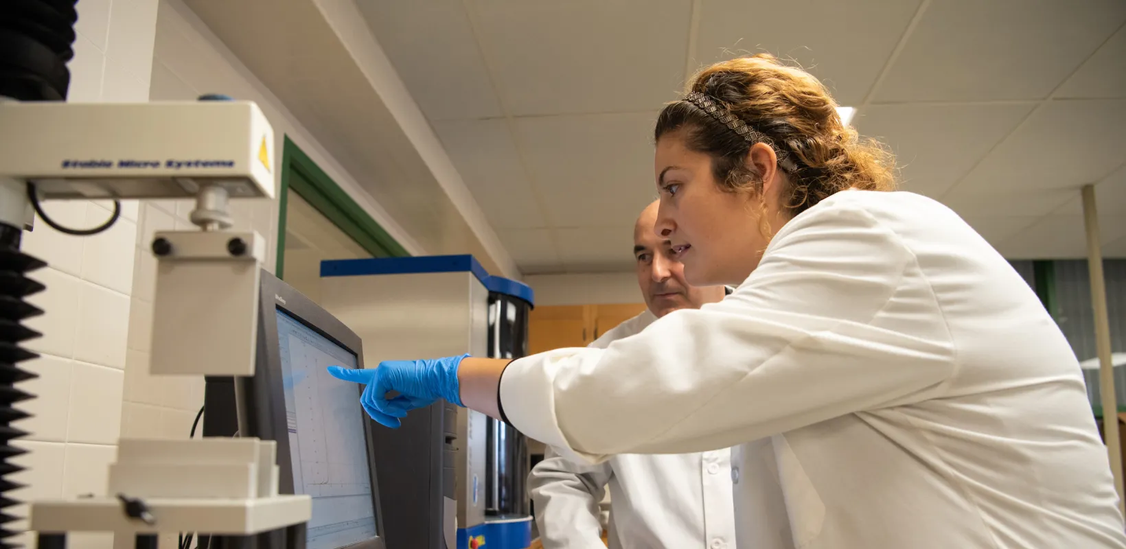 students viewing experiment results in a lab