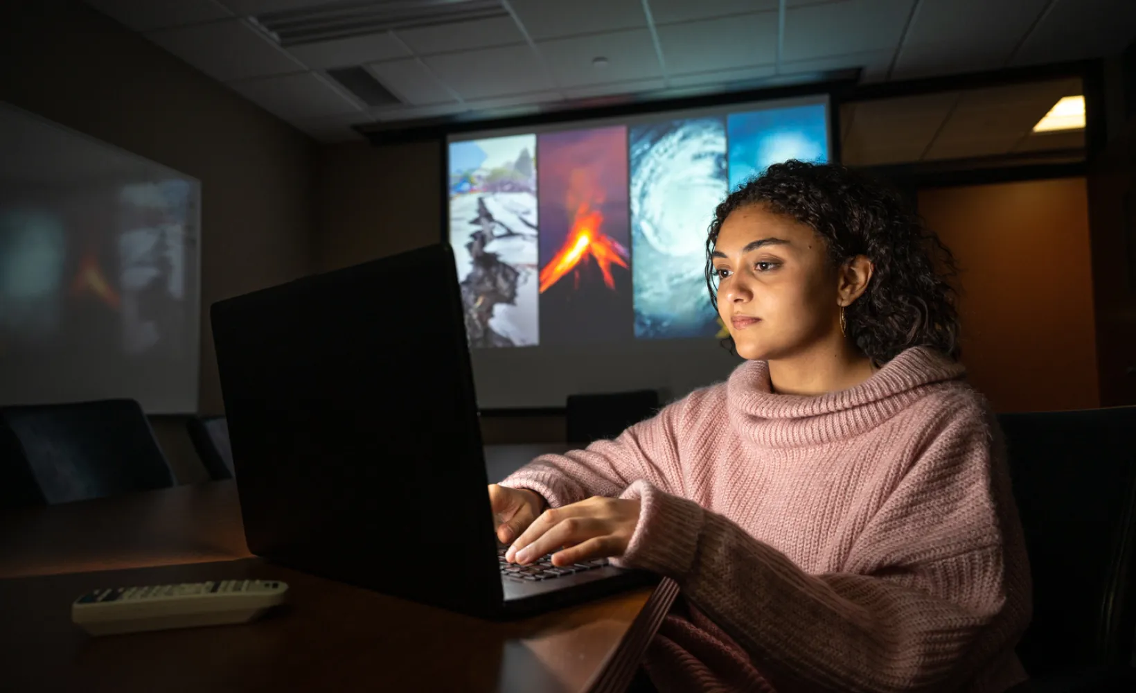 Emergency Management student working on a laptop