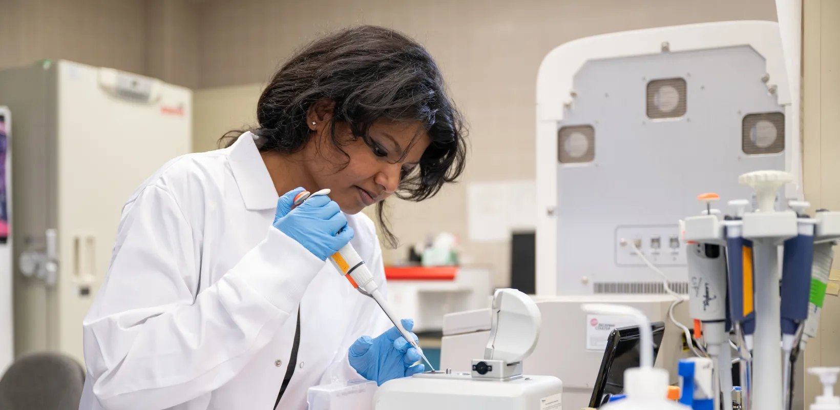 student working with samples in a lab