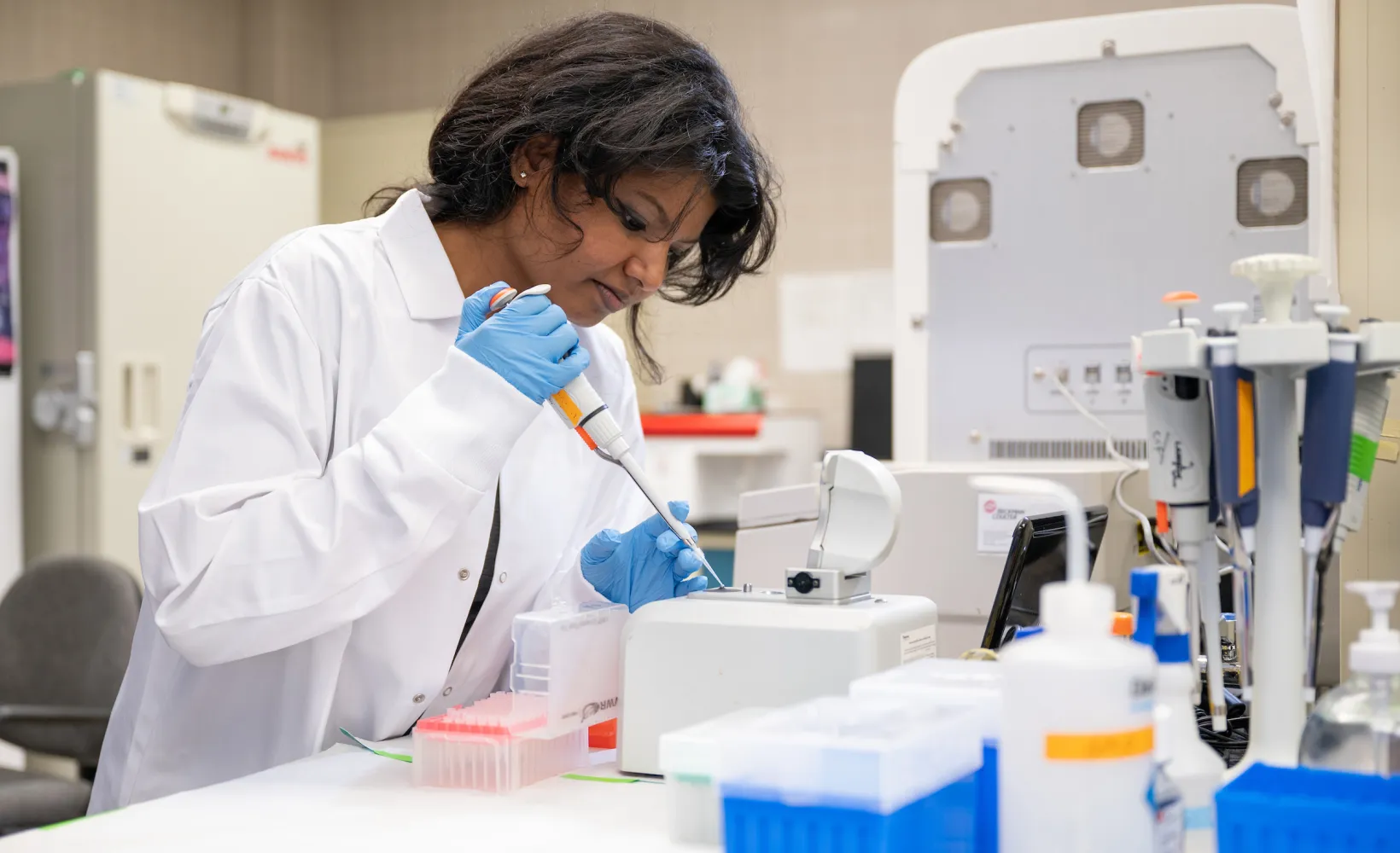 student working with samples in a lab